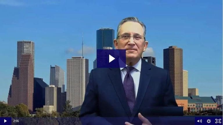 Man in suit standing in front of a city skyline with skyscrapers.