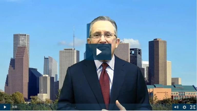 Man speaking in front of city skyline video thumbnail.