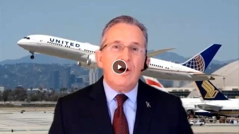 Man speaking with a United Airlines plane taking off in the background.