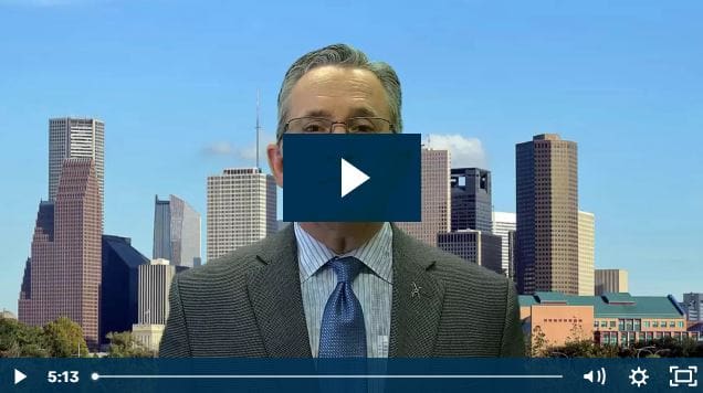 Man in suit with city skyline in background, video overlay.