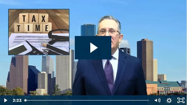 Tax time video with office background and accounting tools on desk.