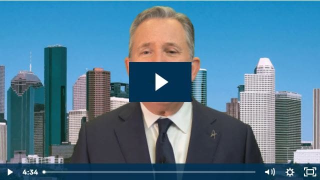 Video thumbnail of a person in a suit with a city skyline background.