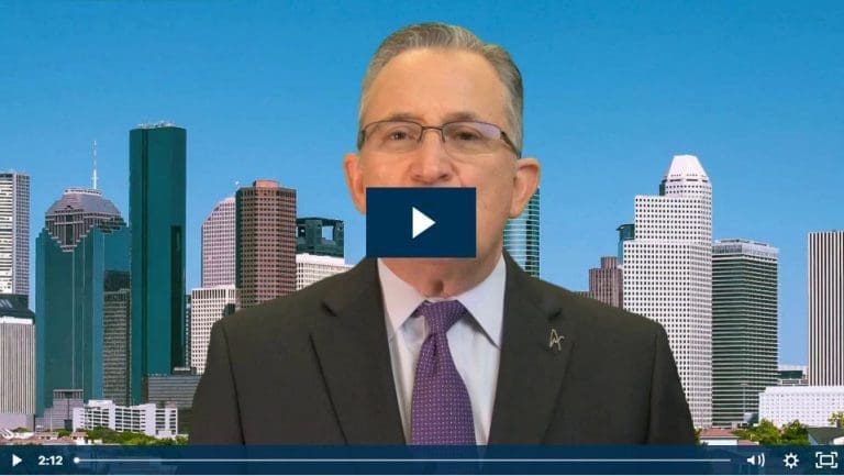 Businessman speaks in front of city skyline backdrop