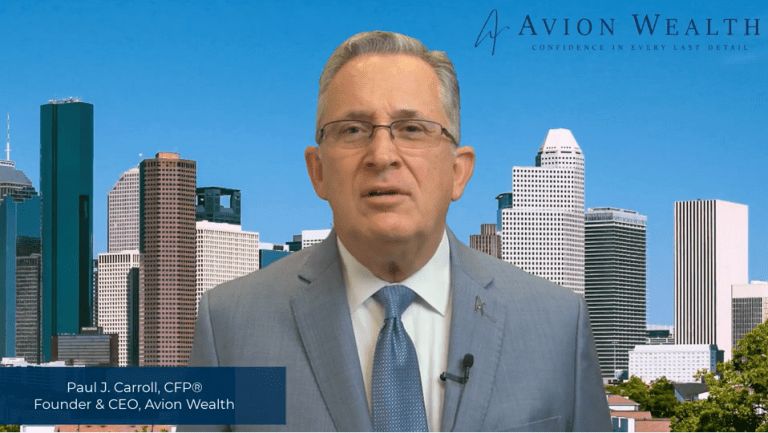 Business professional in suit with city skyline background, Avion Wealth branding visible.