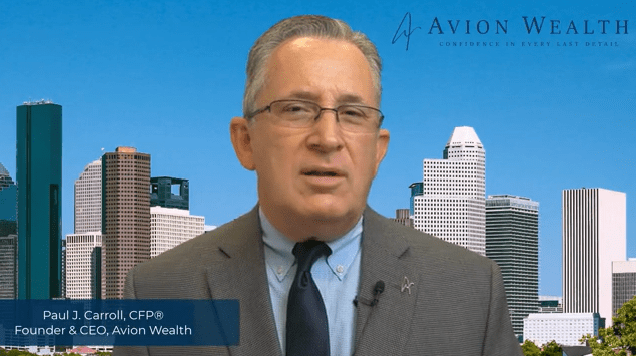 Businessman speaking in front of city skyline backdrop.