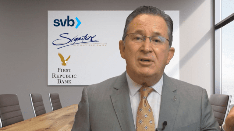 Businessman speaking in conference room with bank logos in background.