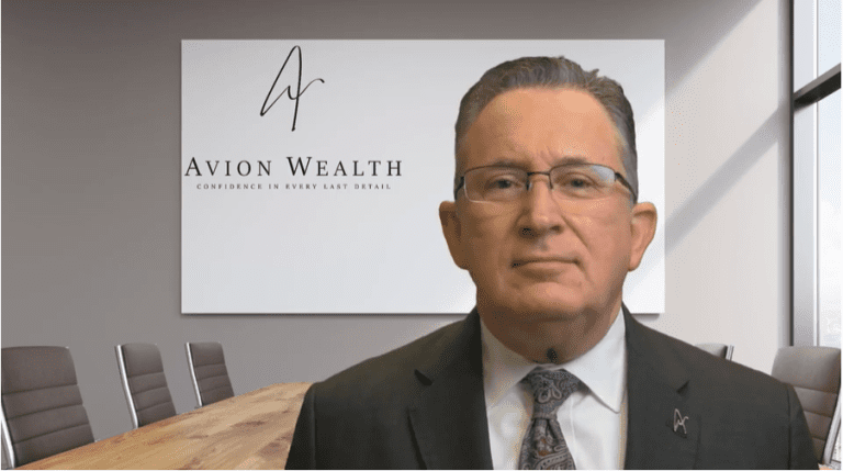Man in office with Avion Wealth sign in background.