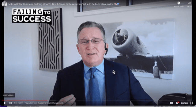 Man in suit speaking about business strategies with Failing to Success sign.