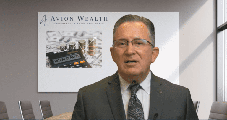 Financial advisor in office with interest rates board background.