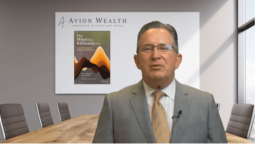 Businessman presenting The Missing Billionaires book in a conference room.