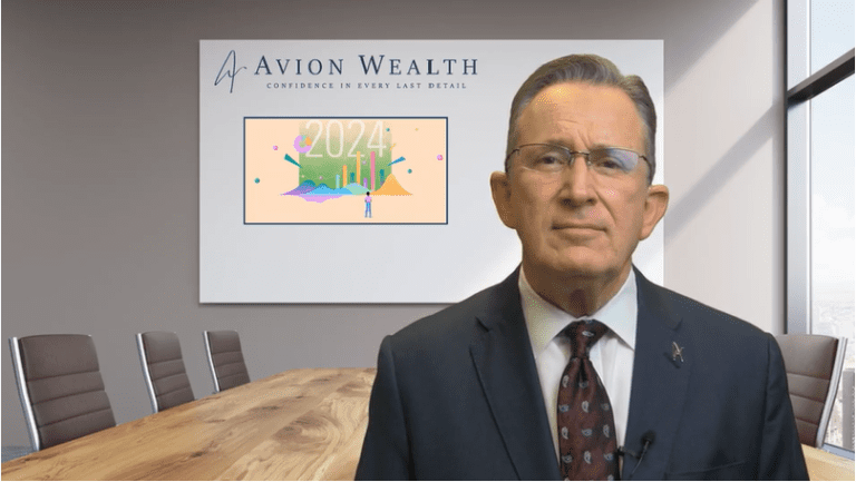 Man in suit presenting financial forecast in conference room.