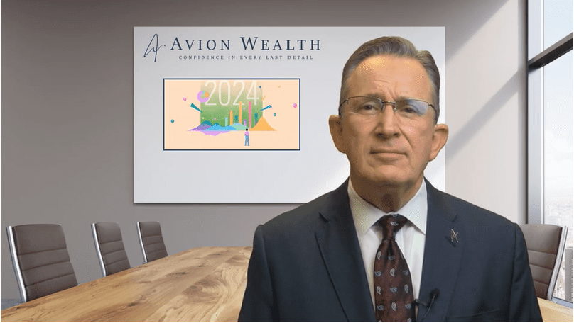Man in suit presenting financial forecast in conference room.