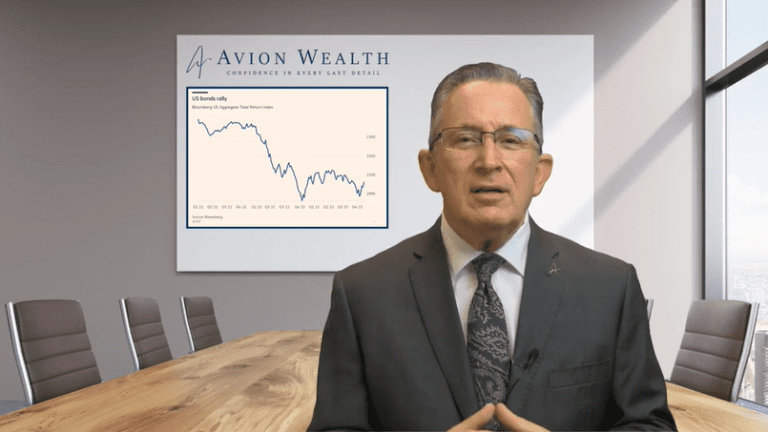 Executive presenting financial data in a modern conference room.