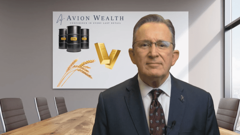 Man in office with Avion Wealth commodities poster.