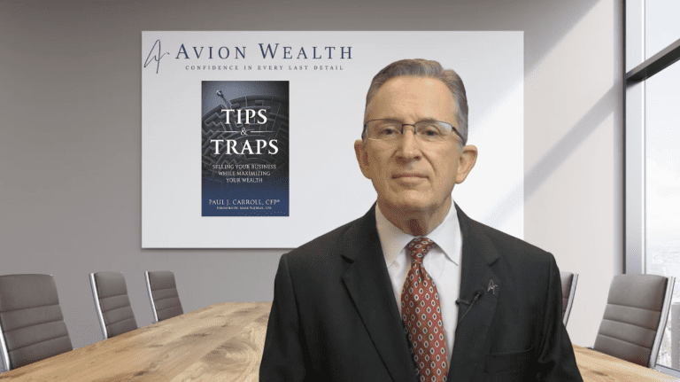 Man presents book Tips & Traps in Avion Wealth office.