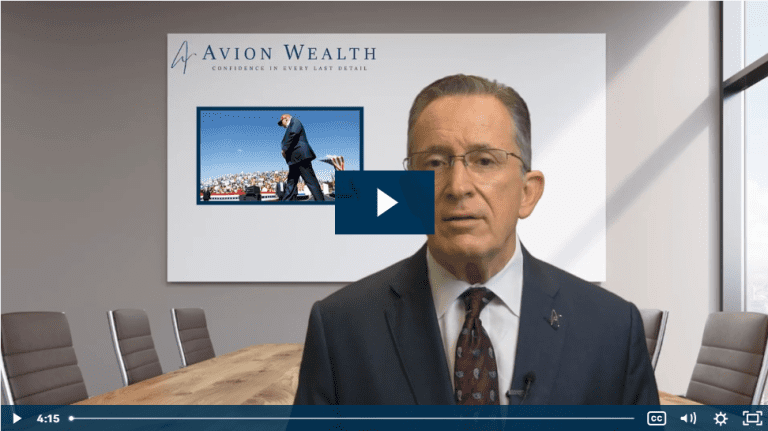 Man in suit giving a presentation at Avion Wealth office.