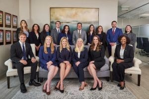 Professional team group photo in office setting.