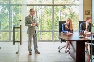 A business meeting in a conference room with a presentation.
